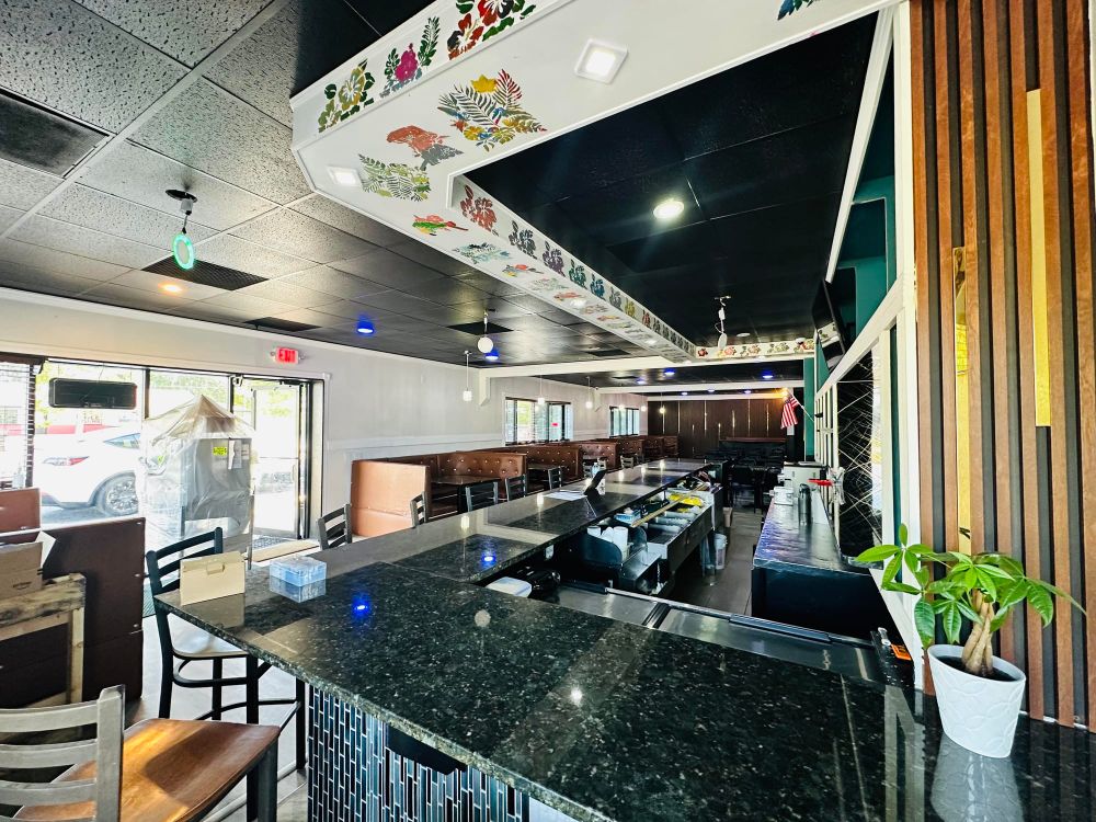Full bar with marble counter and lounge seating