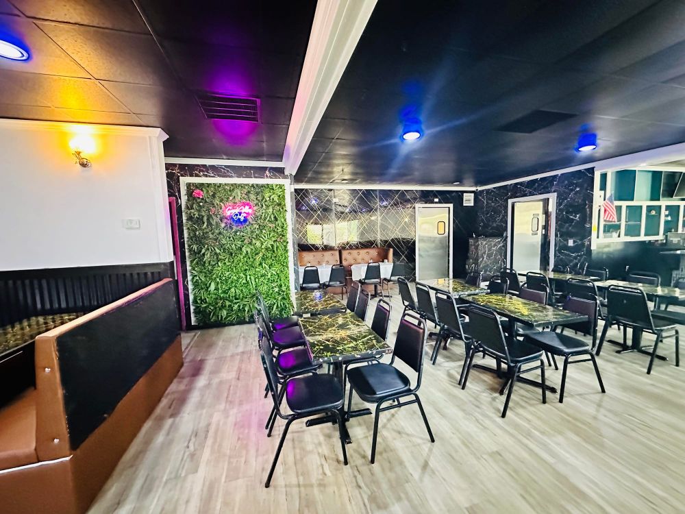 Main dining room with brown booths and modern lighting
